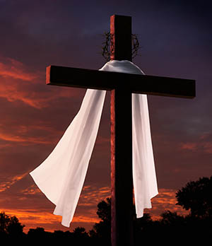 Dramatic Lighting on Christian Easter Cross at Sunrise