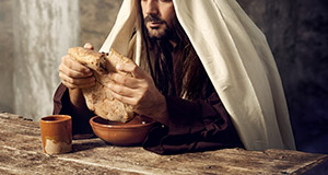 Jesus breaks the bread